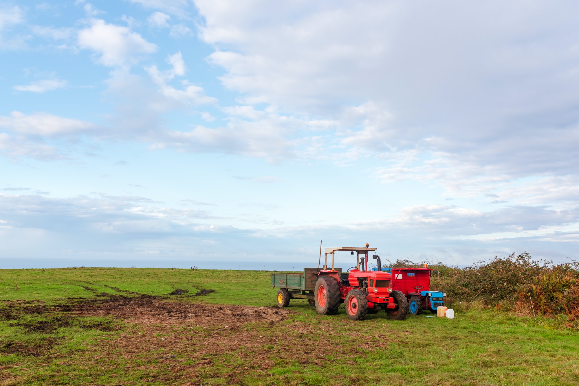 old tractors stopped after a day's work in the field.